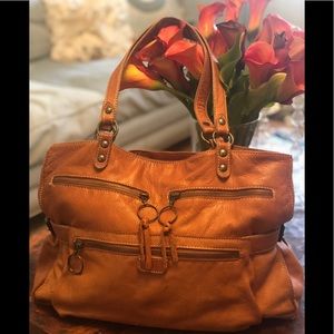 Regina brand soft beautiful camel colored leather.